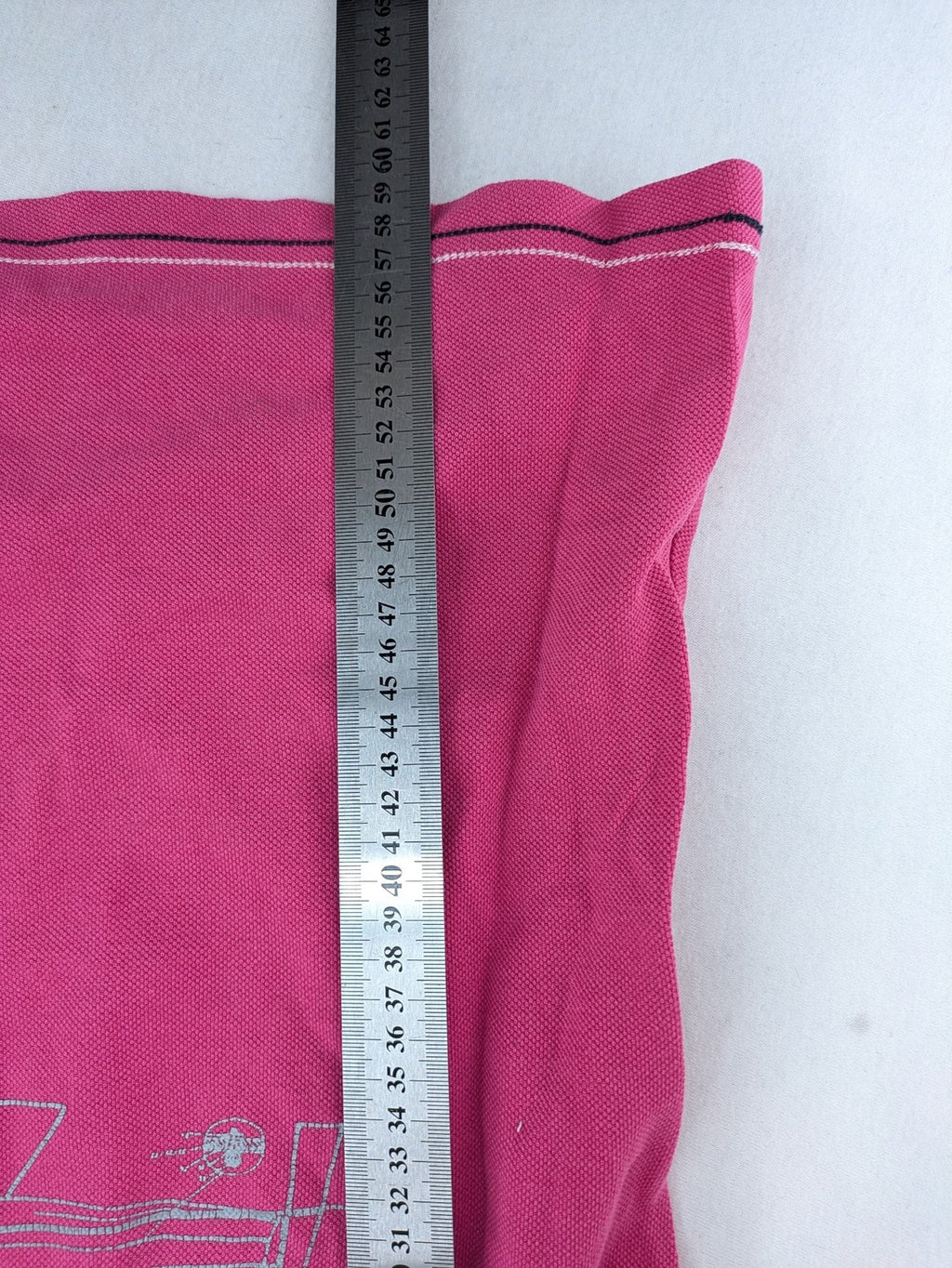 Geographical Norway pink polo shirt with embroidered Saint Malo design and Gingham trim.
