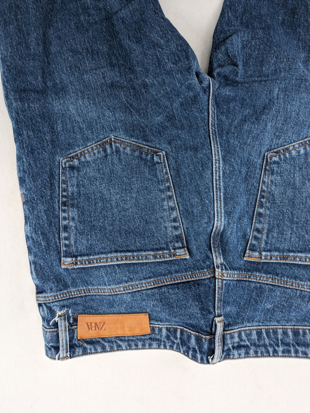 Zara blue straight jeans with classic 5-pocket design and button fly.