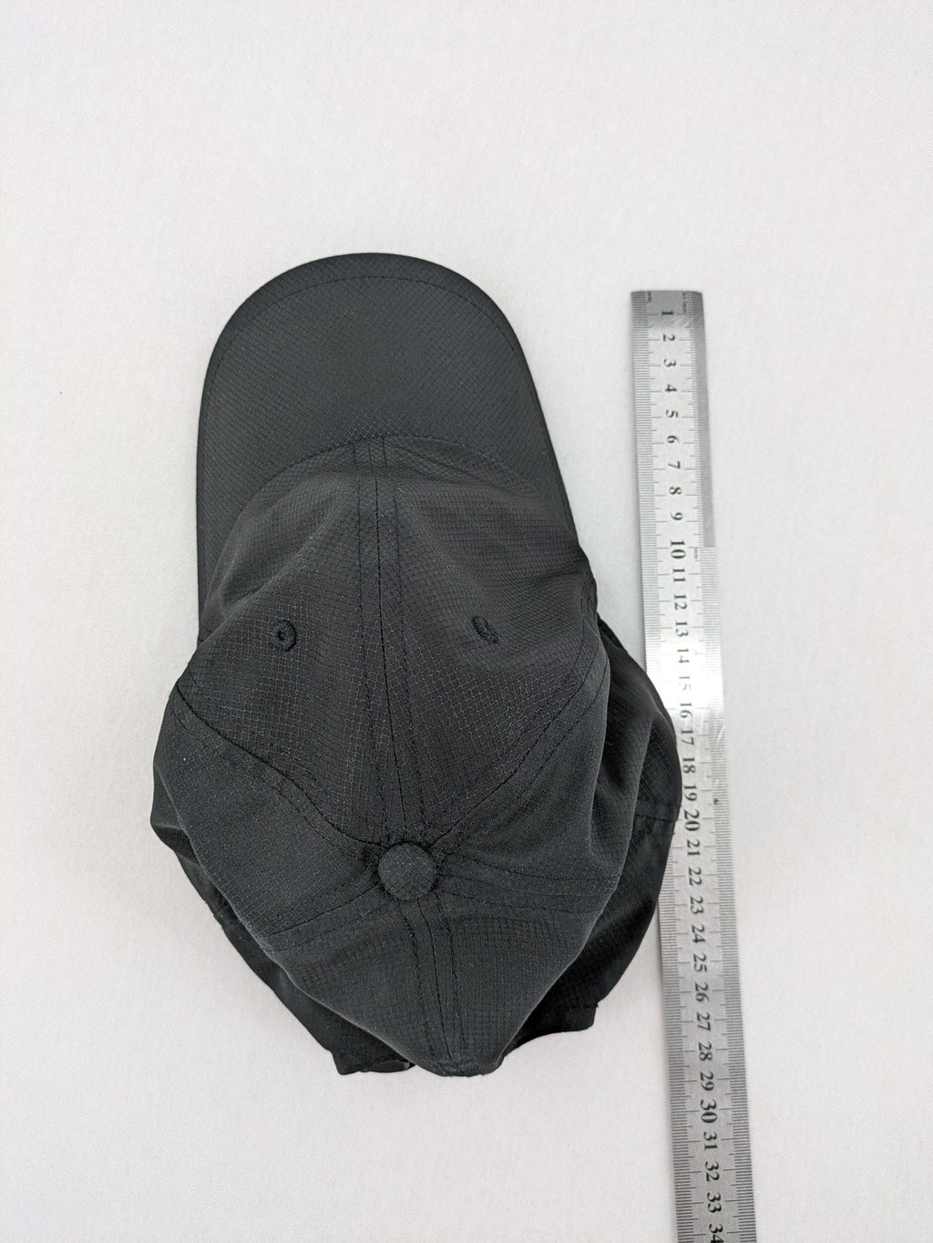 Dormakaba grey baseball cap 6-panel design with white embroidered logo and adjustable strapback.
