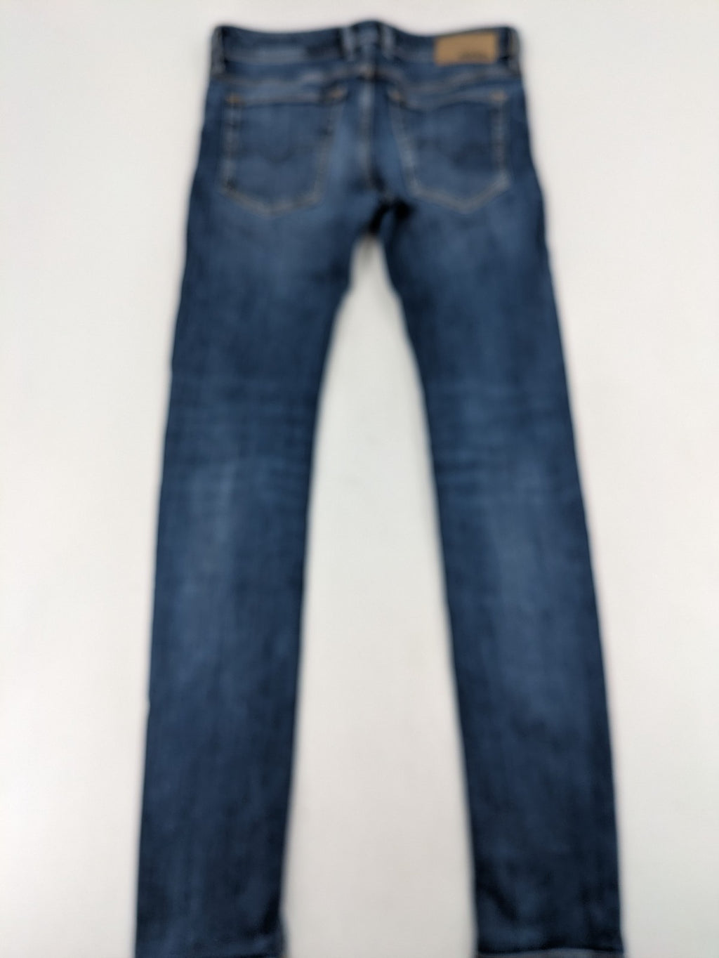 Diesel blue slim skinny jeans with logo patch and stretch denim material.
