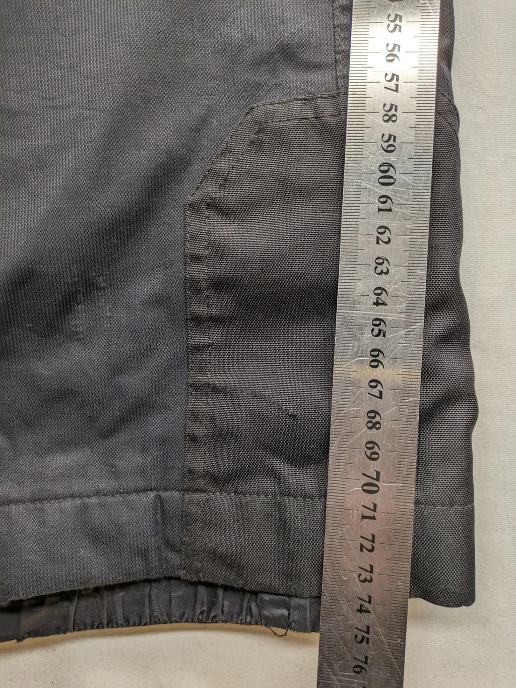 Schoffel black ski pants with adjustable straps, zip pockets, and snow gaiters.