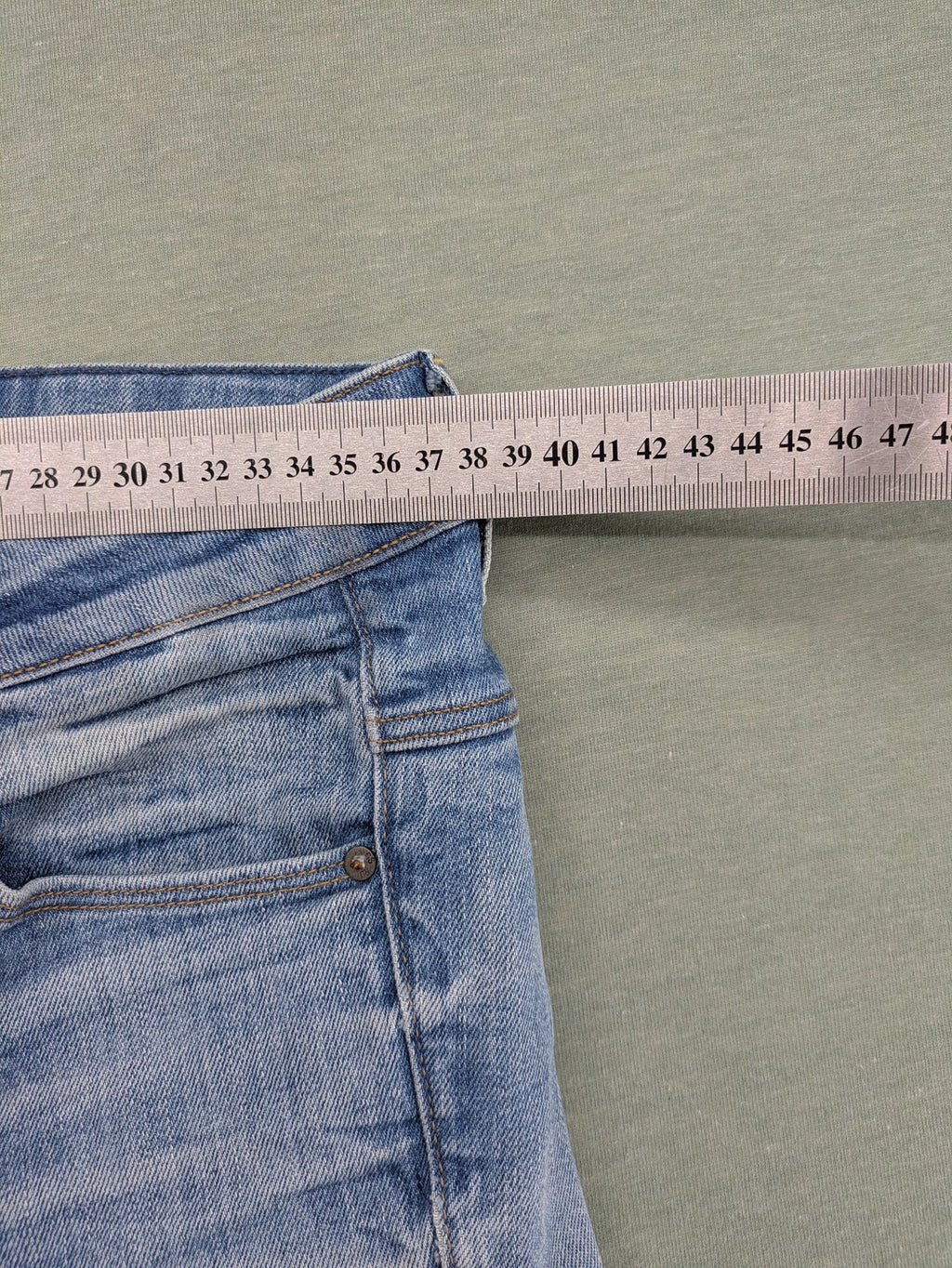 G-Star Raw blue slim skinny jeans with light wash and signature back zip pocket.