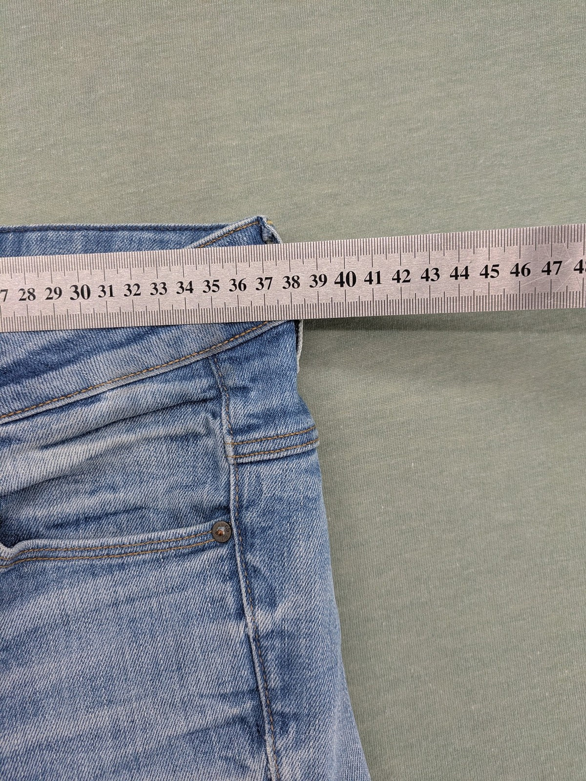 G-Star Raw blue slim skinny jeans with light wash and signature back zip pocket.