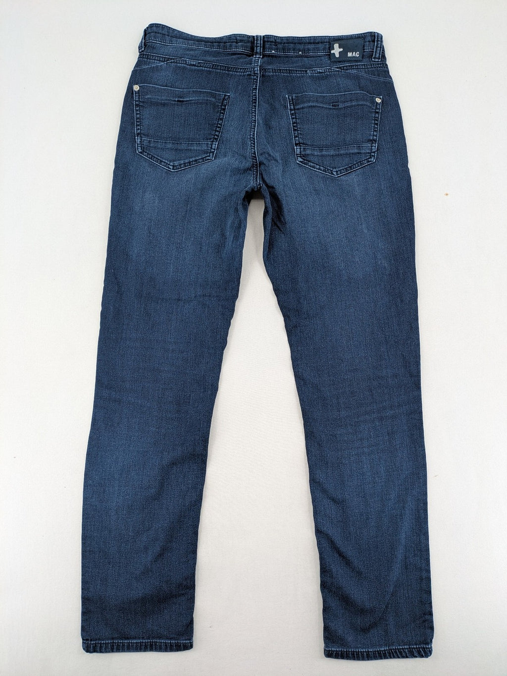 Mac Jeans blue slim fit straight jeans with light wash and stretch material.