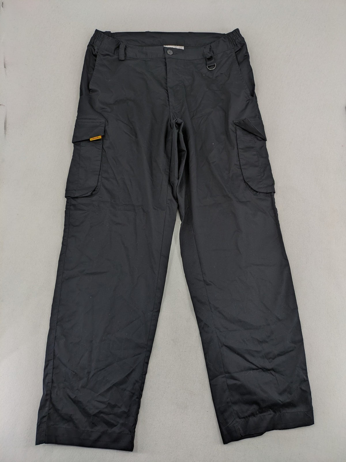DHL grey cargo pants with iconic logo and multiple pockets, made from stretch cotton.