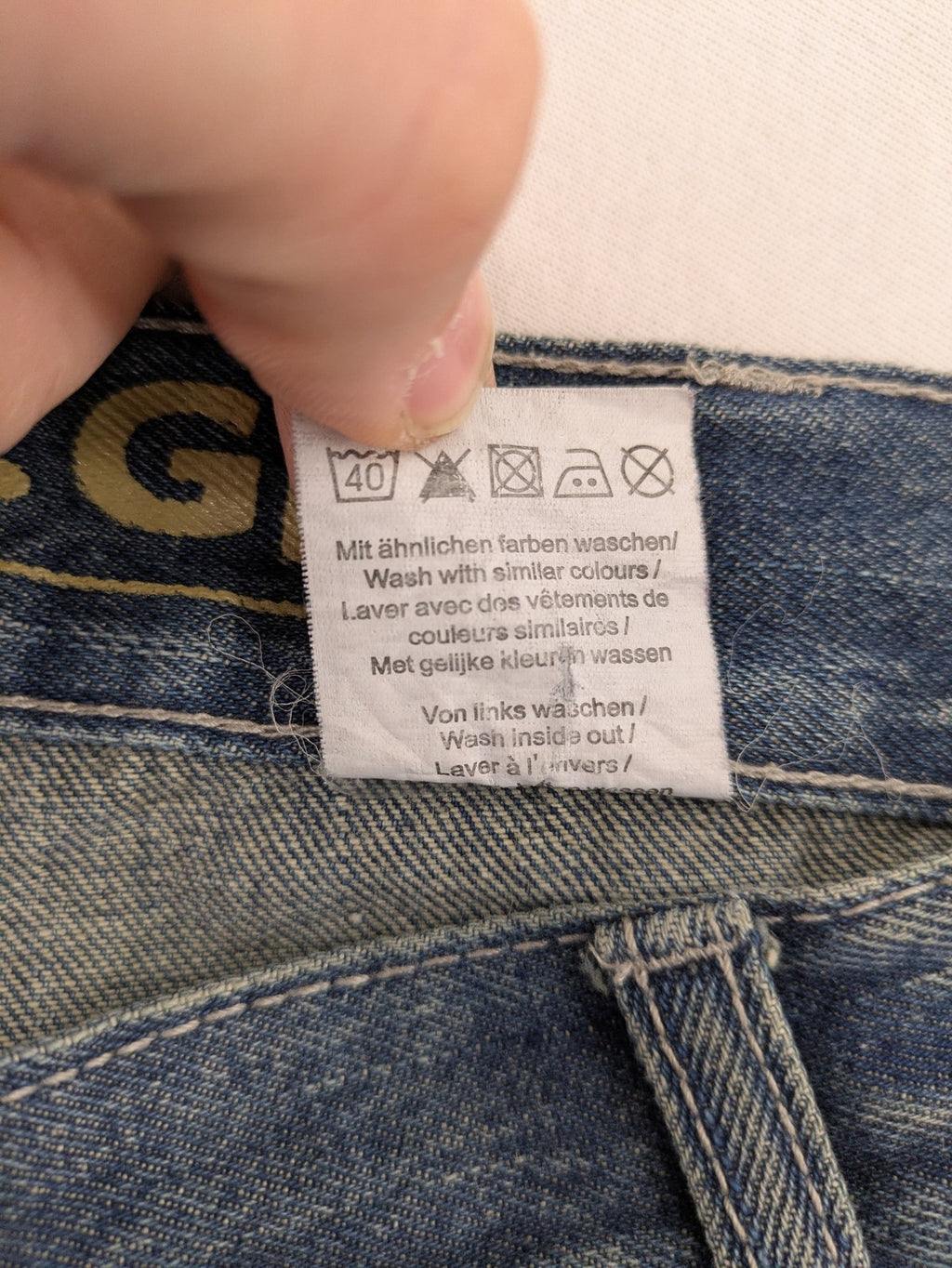 John F. Gee blue straight jeans with reinforced knees and durable denim material.