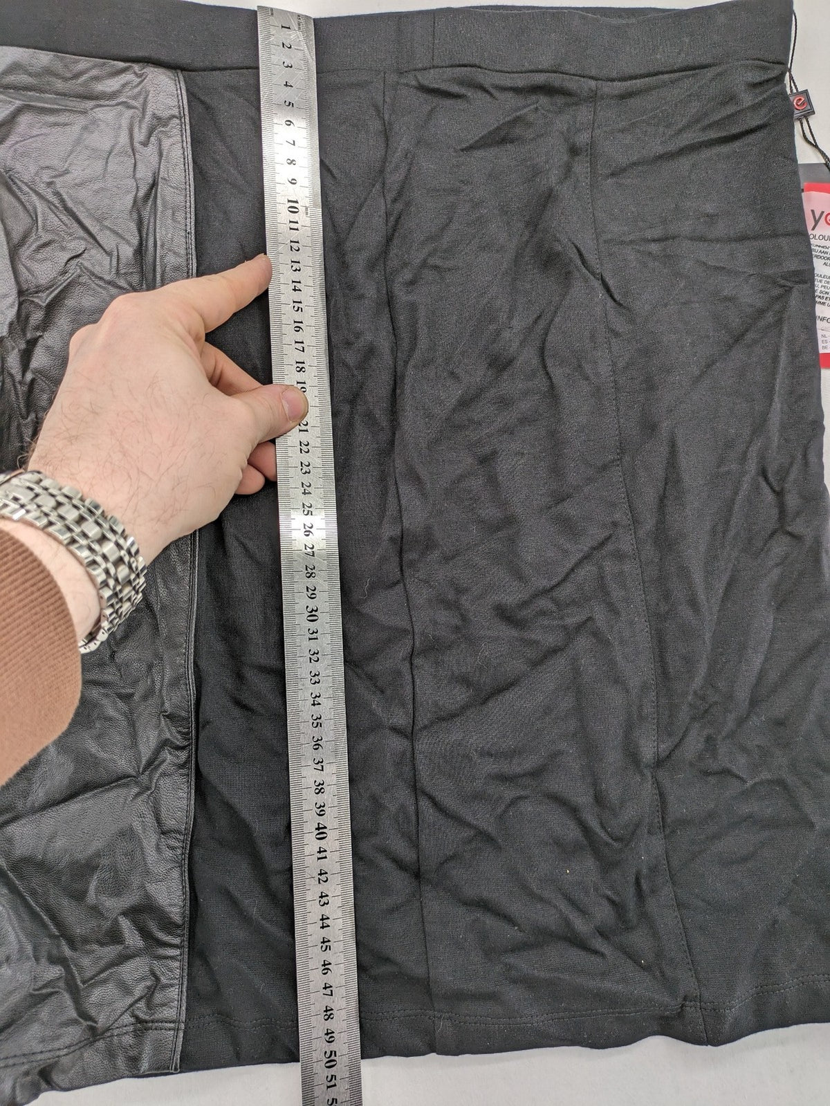 Yest black long skirt with grey faux leather panel and stretchy fabric.