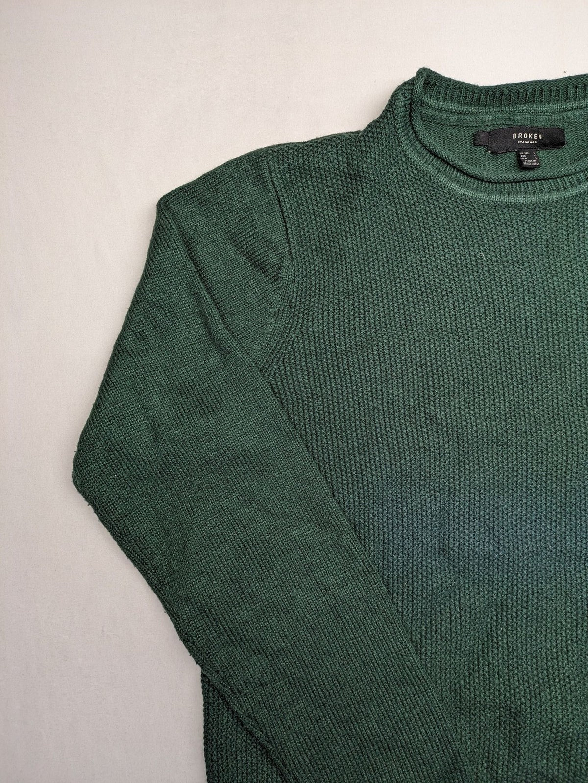 Broken Standard turtle neck jumper green waffle knit texture with classic round neckline.
