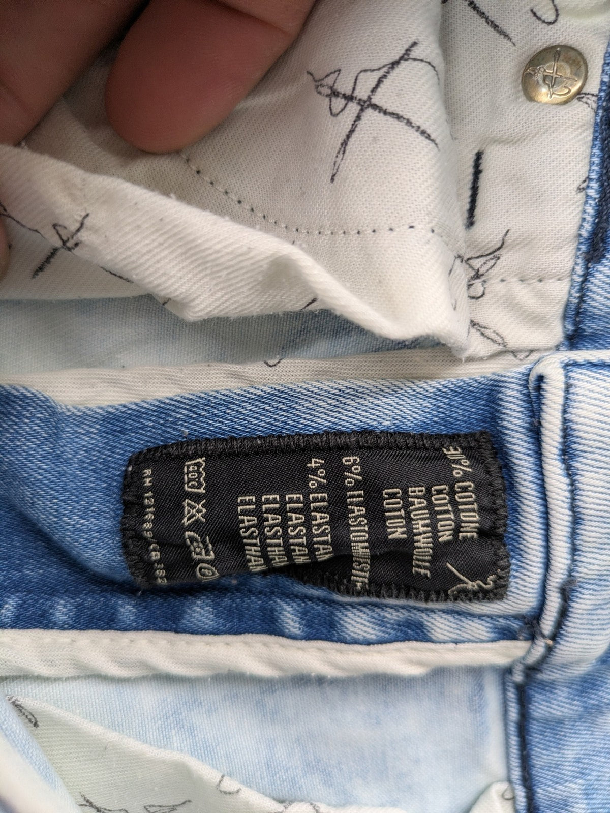 Drykorn blue slim fit jeans with acid wash and leather logo patch.