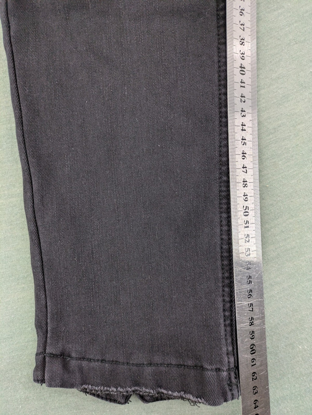 Disney black straight jeans with Minnie Mouse detail, cropped length, stretchy cotton blend.