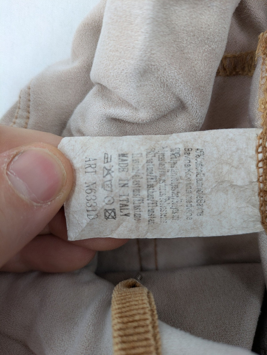 Made In Italy beige pants with crinkle texture and rock-style patches, drawstring waist.