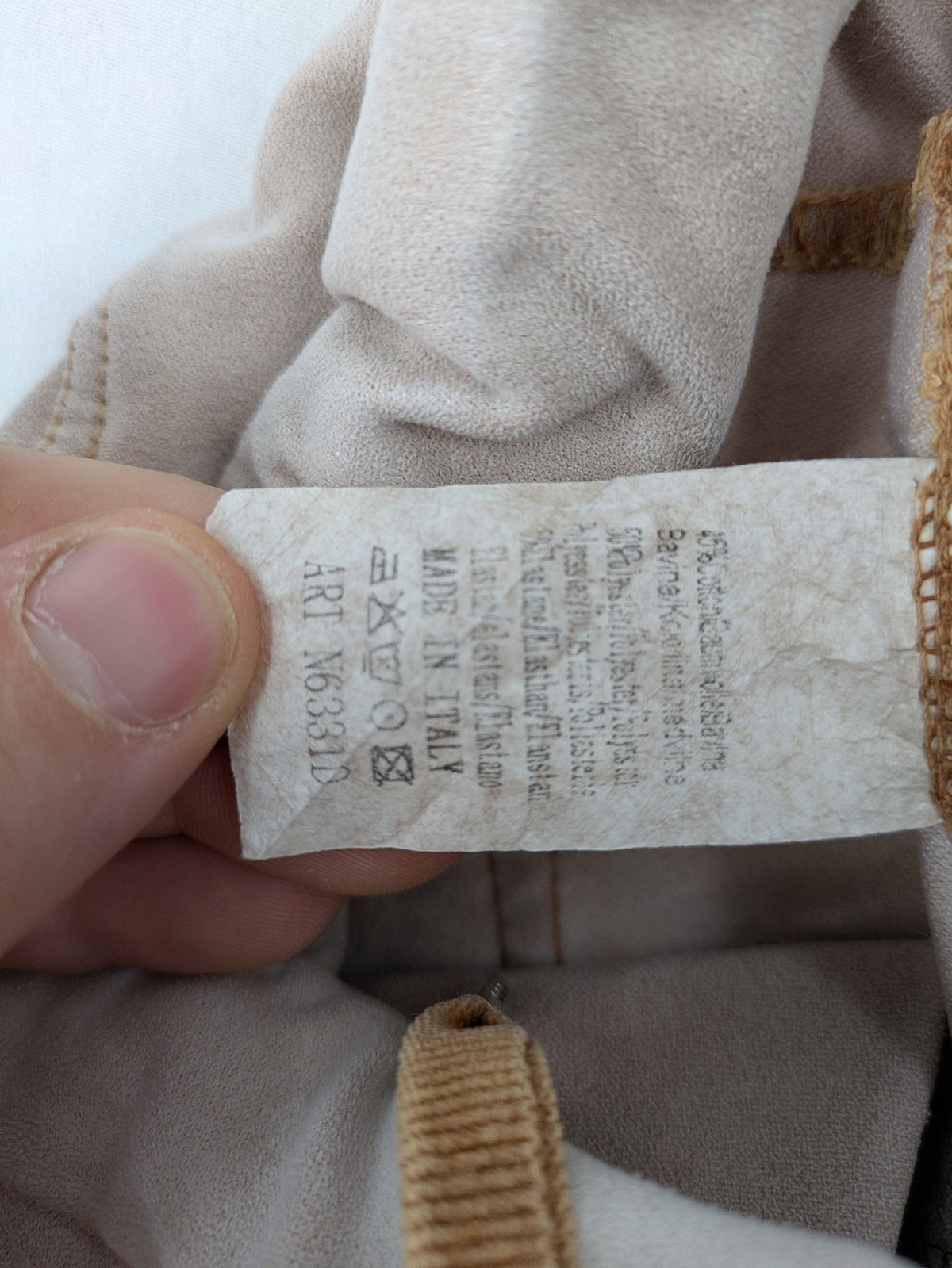 Made In Italy beige pants with crinkle texture and rock-style patches, drawstring waist.