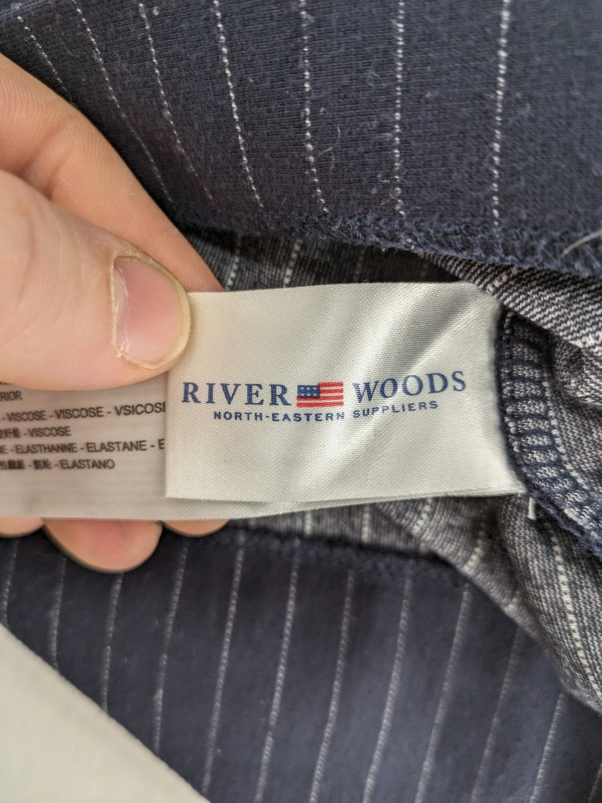 RIVER WOODS navy long sleeve top with white pinstripes and red "I AM très jolie" slogan.