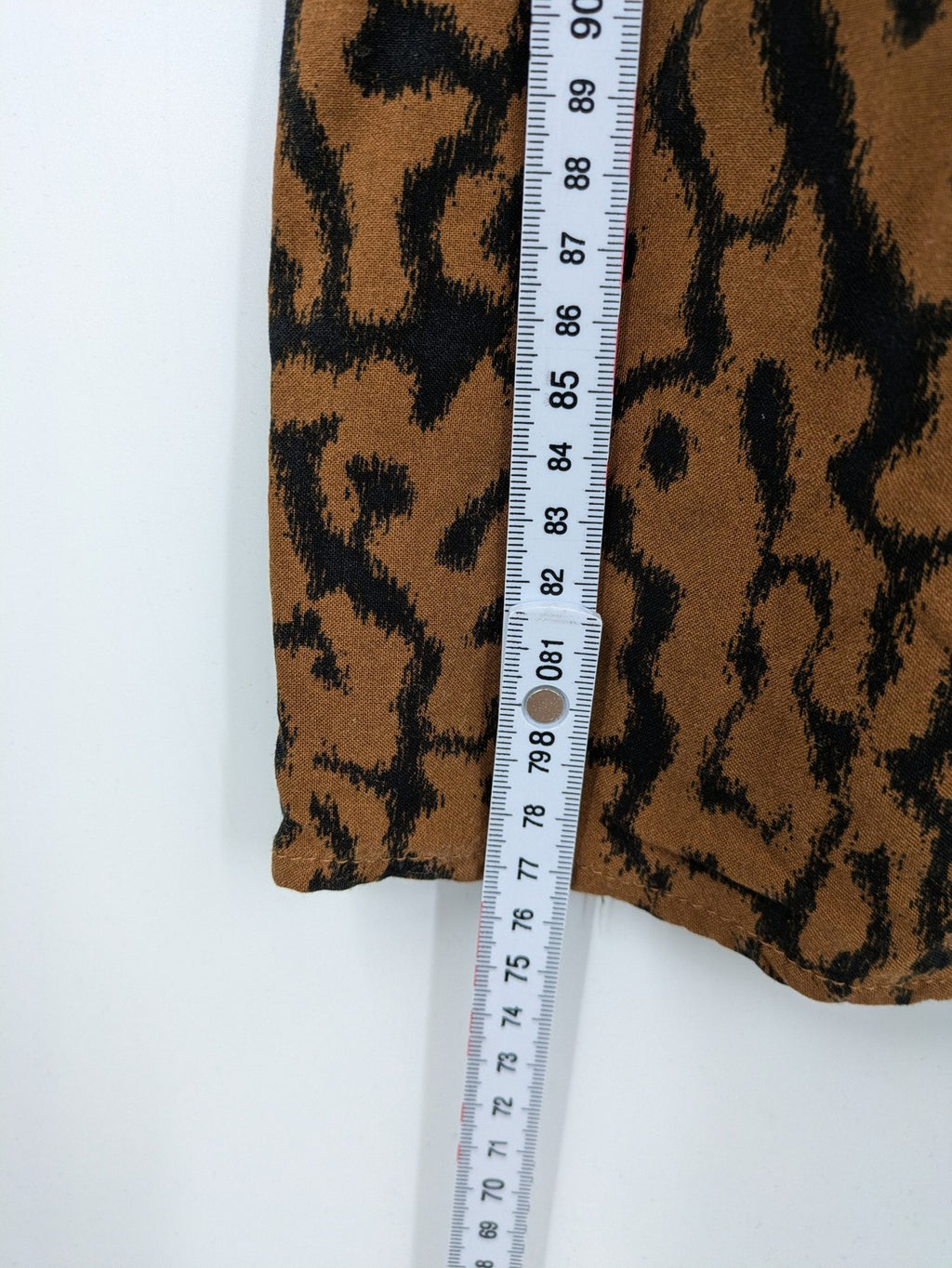H&M brown and black animal print midi dress with smocked bodice and square neckline.