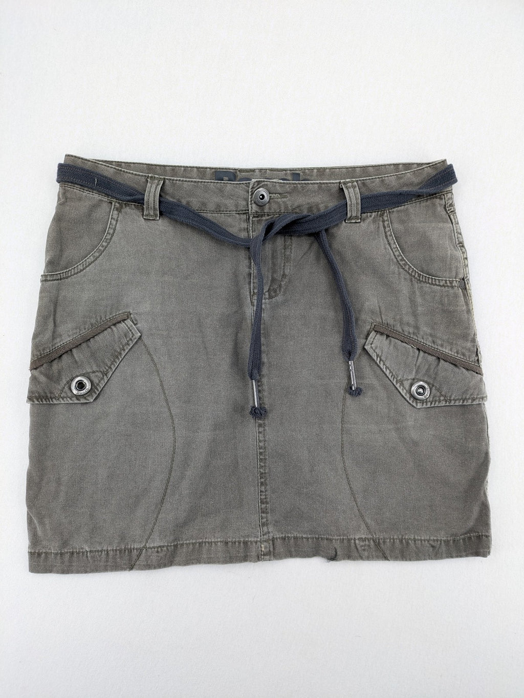 Bench khaki cargo mini skirt with belt, multiple pockets, and durable cotton material.
