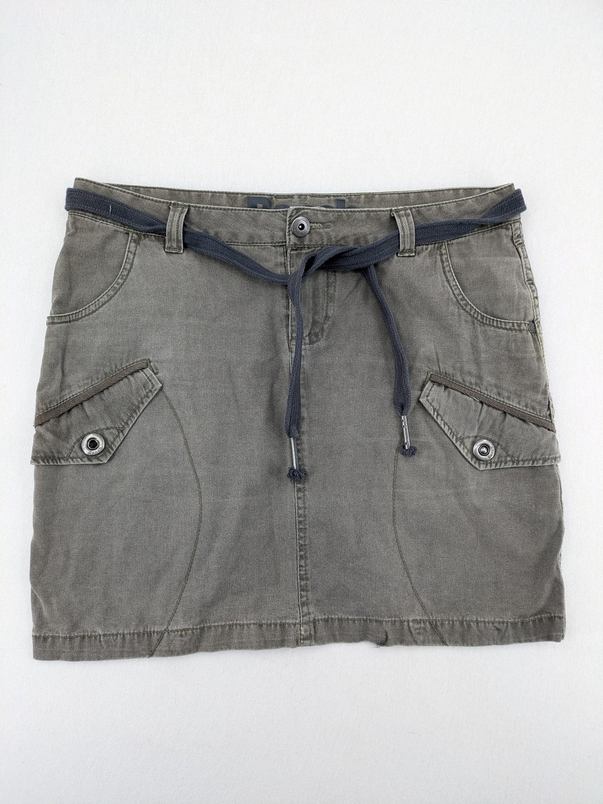 Bench khaki cargo mini skirt with belt, multiple pockets, and durable cotton material.