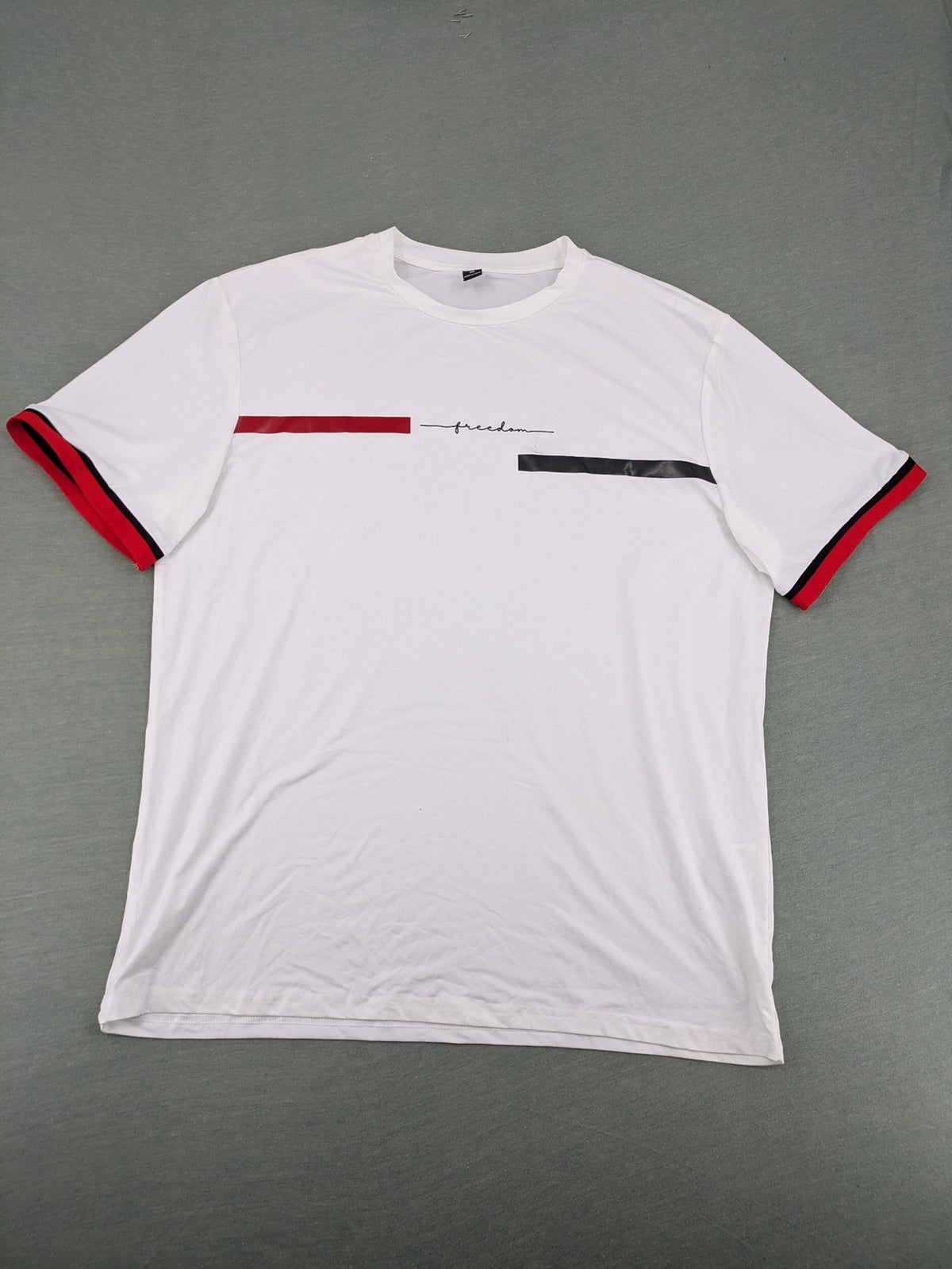 Manfinity black and white outfit set with red accents and "Freedom" graphic print.