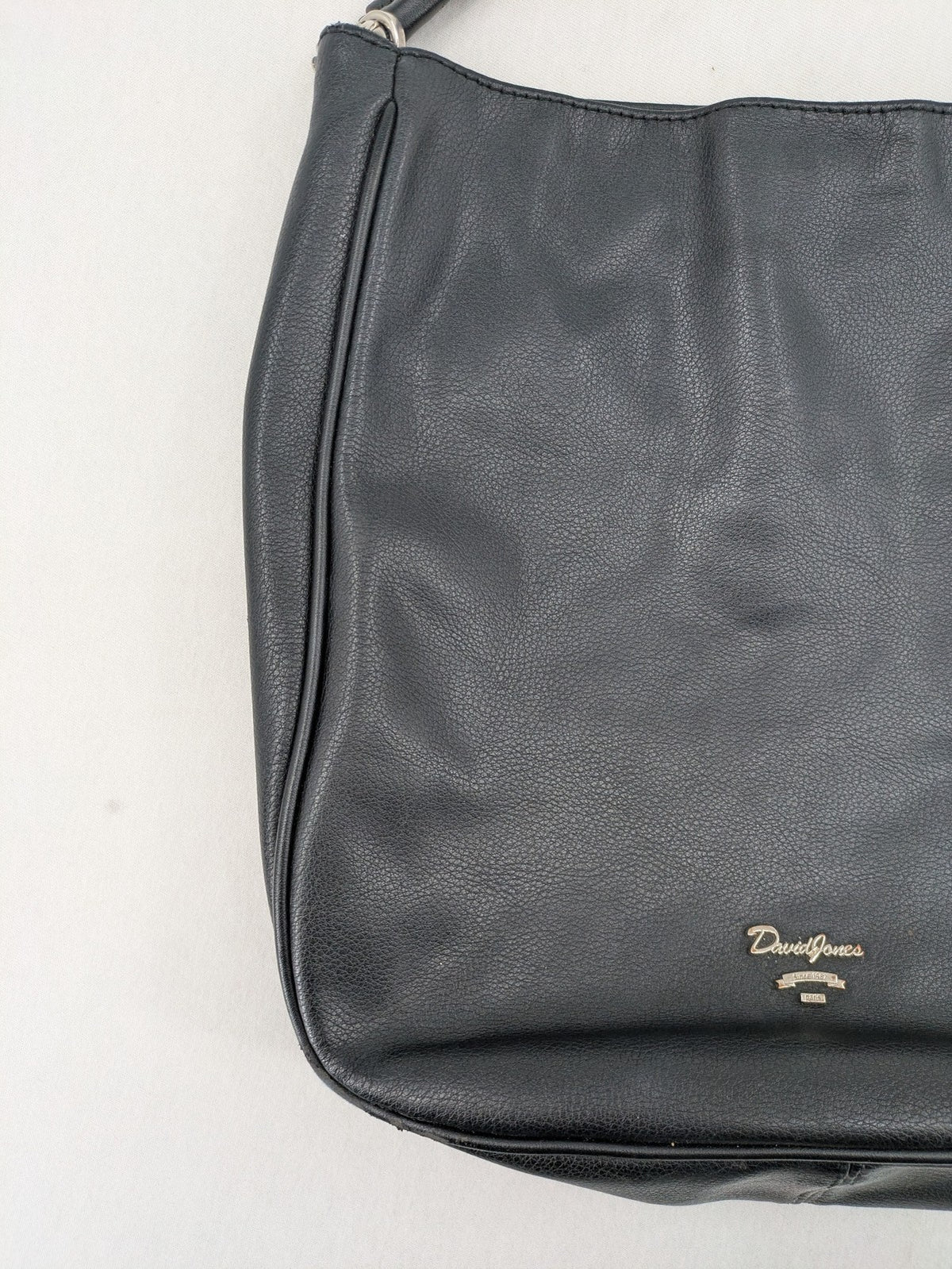 David Jones black hobo handbag pebbled PU leather with silver hardware and zipper closure.