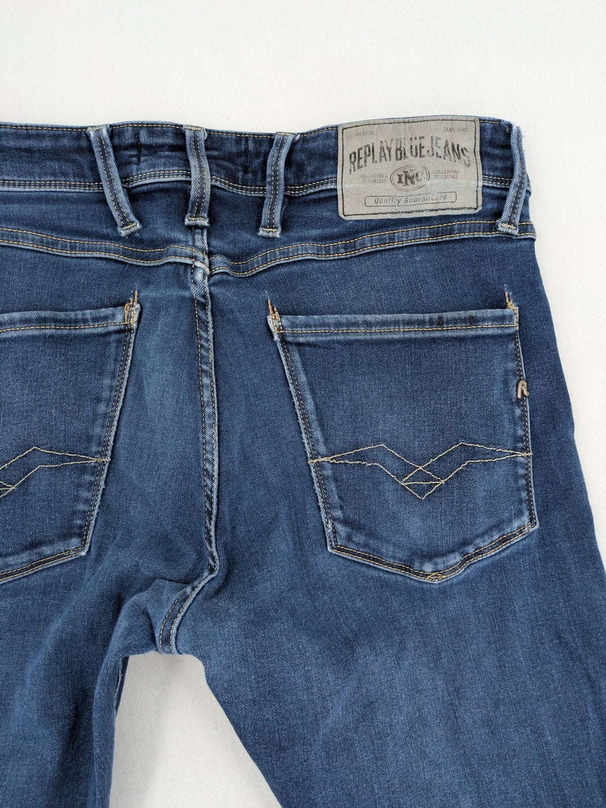 Replay slim fit jeans blue with subtle fading and stretch denim material.