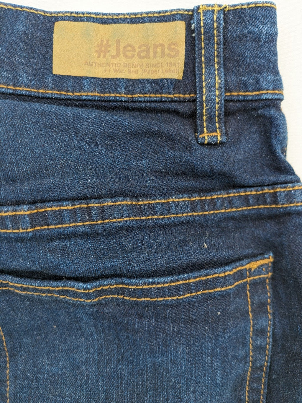 The Straight blue straight leg jeans with contrast stitching and 5-pocket design.