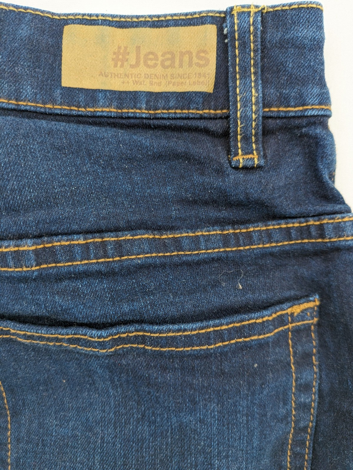 The Straight blue straight leg jeans with contrast stitching and 5-pocket design.
