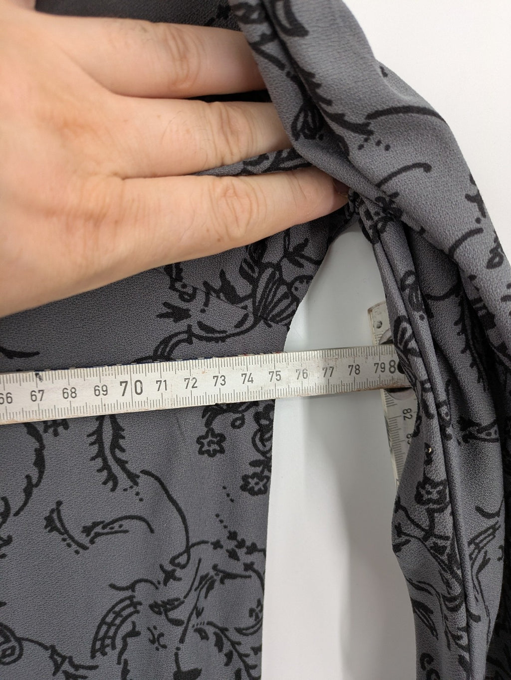 Yessica grey black floral pattern tunic top with round neckline and long sleeves.