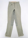 Jodhpur beige and grey riding pants with green check pattern and knee patches.