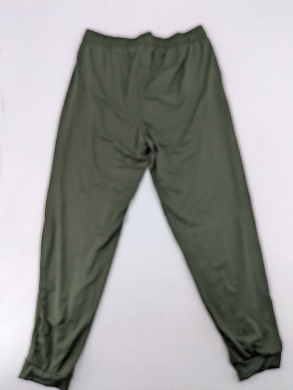 Infinity green jogger pants with elastic waistband and side pockets, soft stretch material.