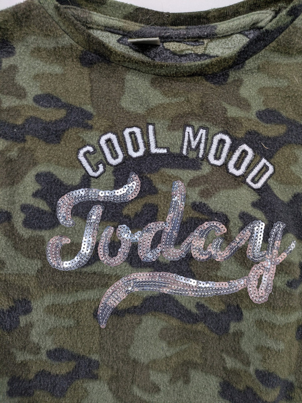 YFK turtle neck jumper multi camouflage print with sequined "COOL MOOD Today" graphic.