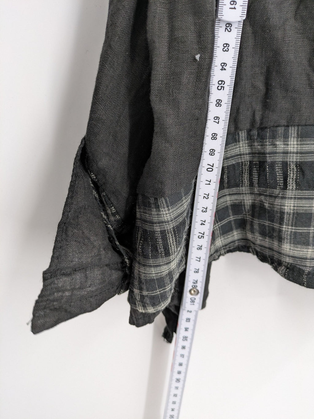 Lagenlook black linen bridal party dress asymmetrical cut with checkered hem and diagonal zipper.