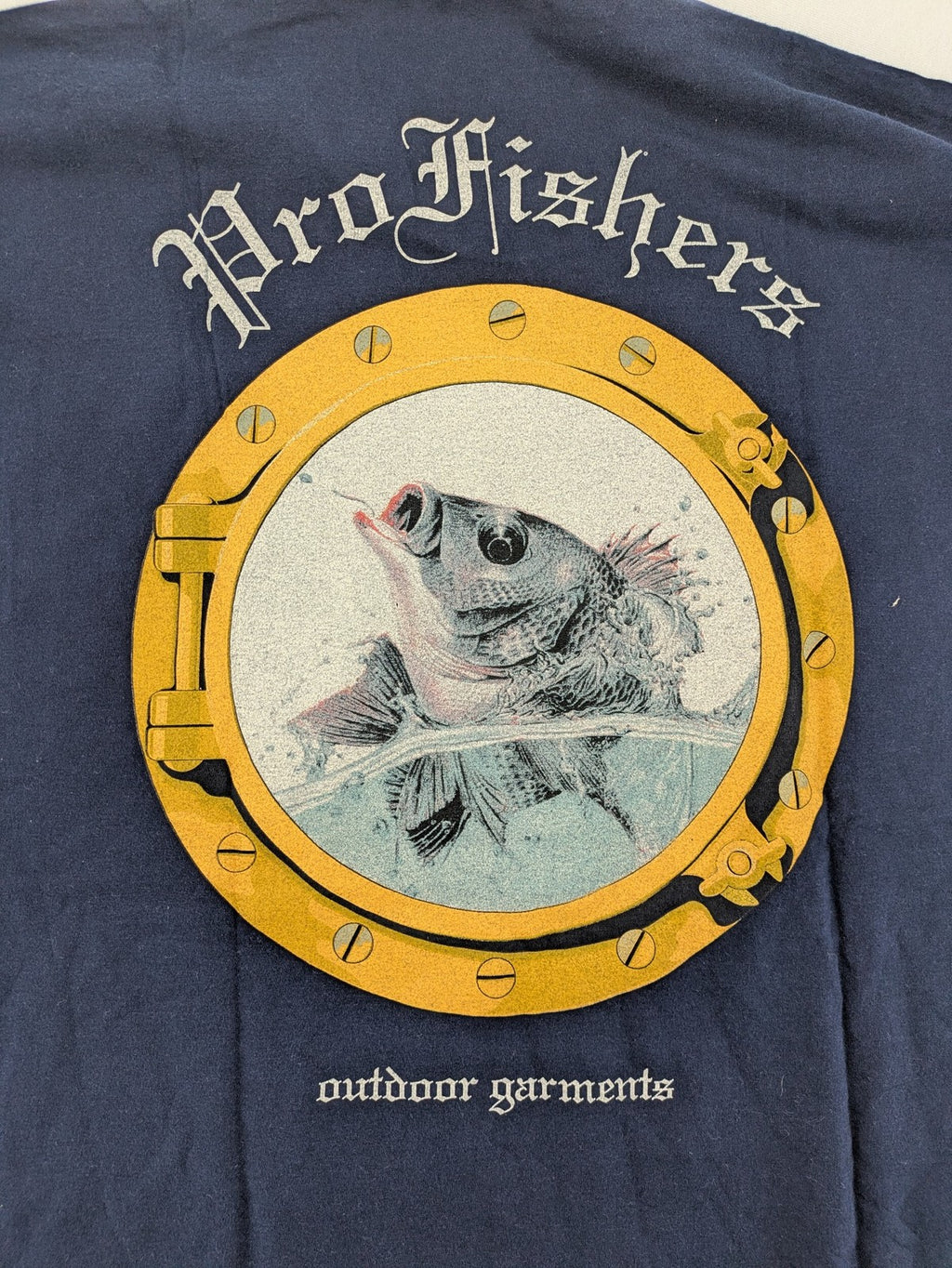 ProFishers navy t-shirt with compass print and large fish graphic on back.