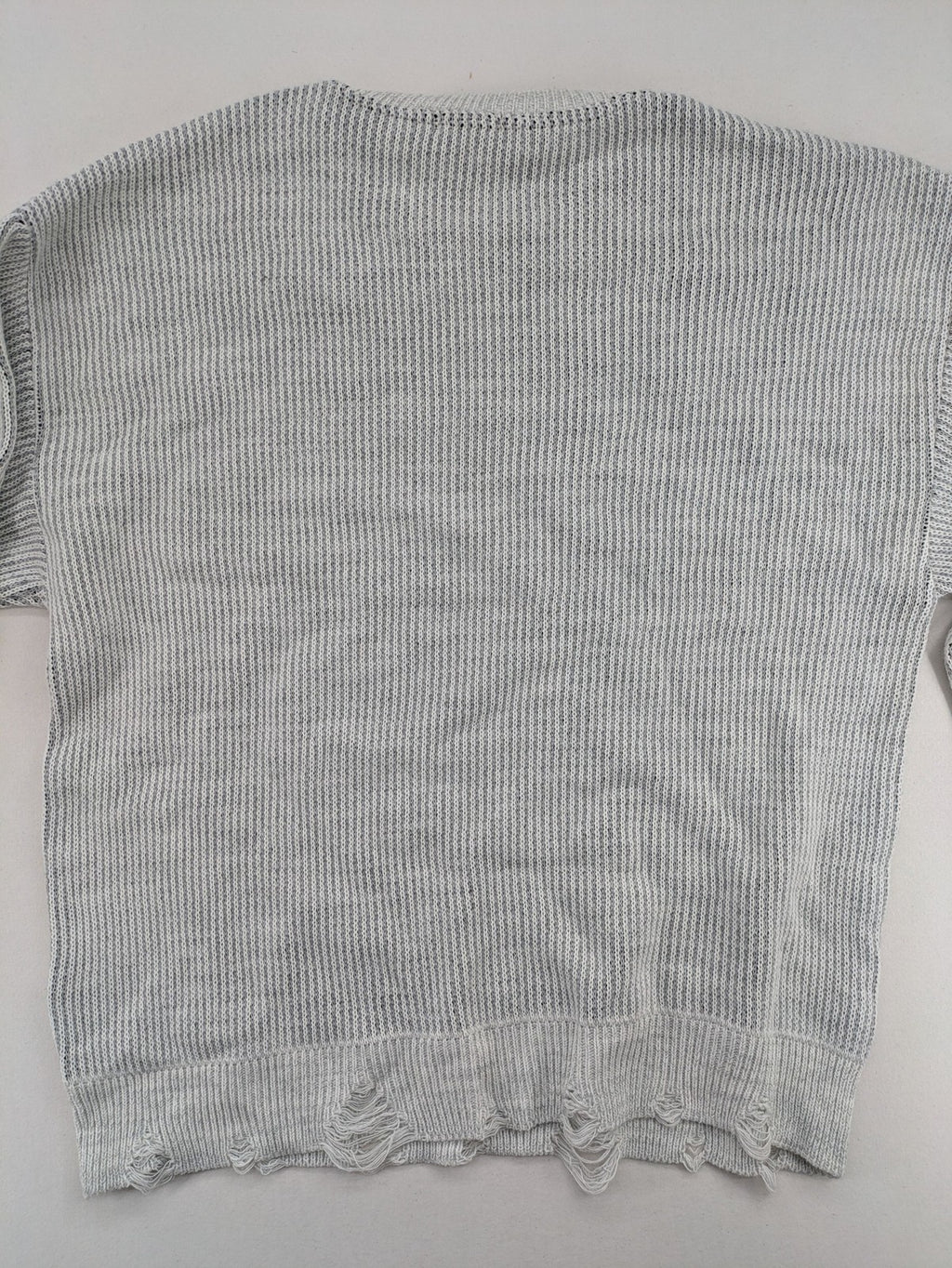 Drizzle turtle neck jumper black grey with abstract graphic print and distressed details.
