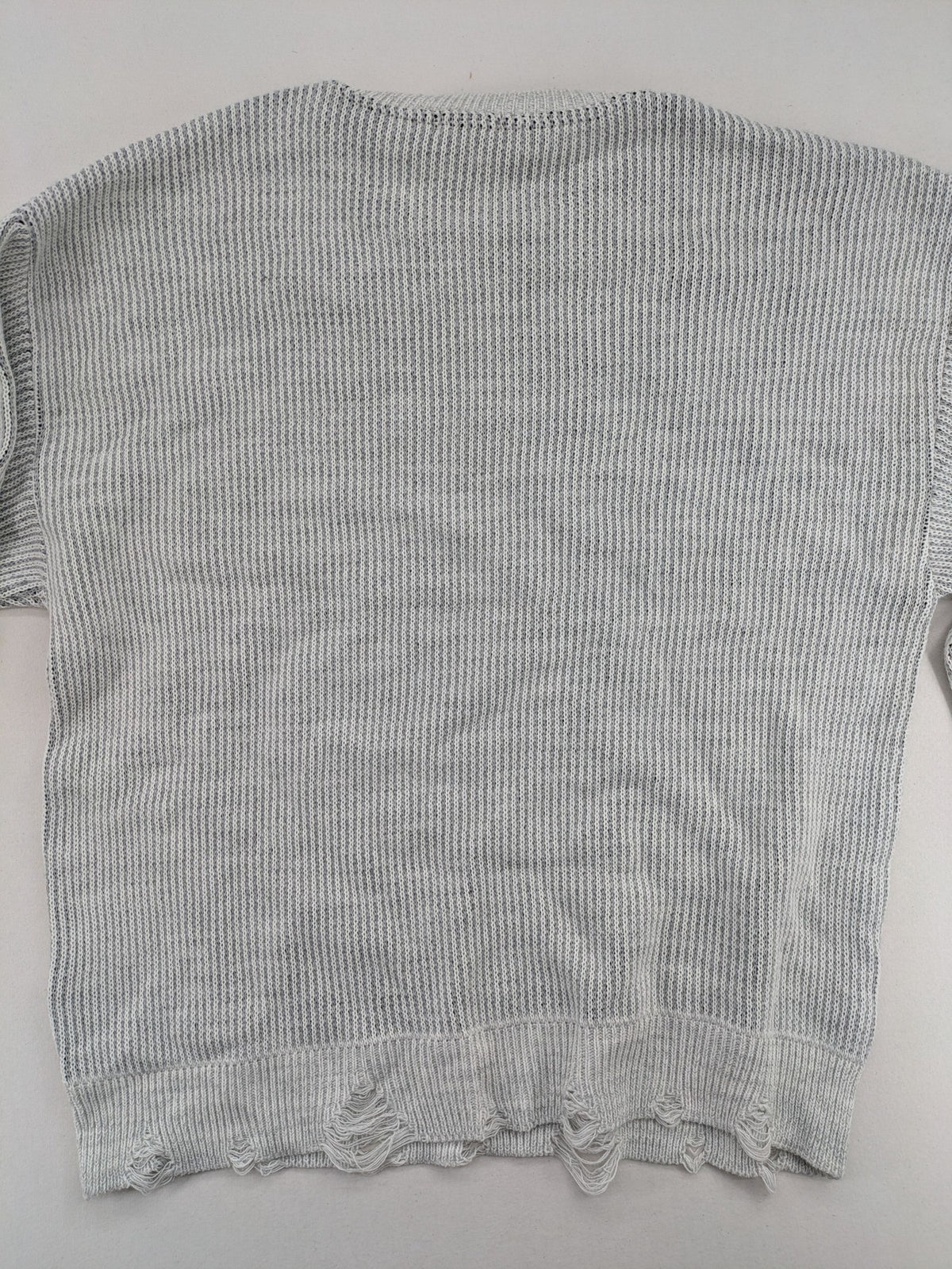 Drizzle turtle neck jumper black grey with abstract graphic print and distressed details.