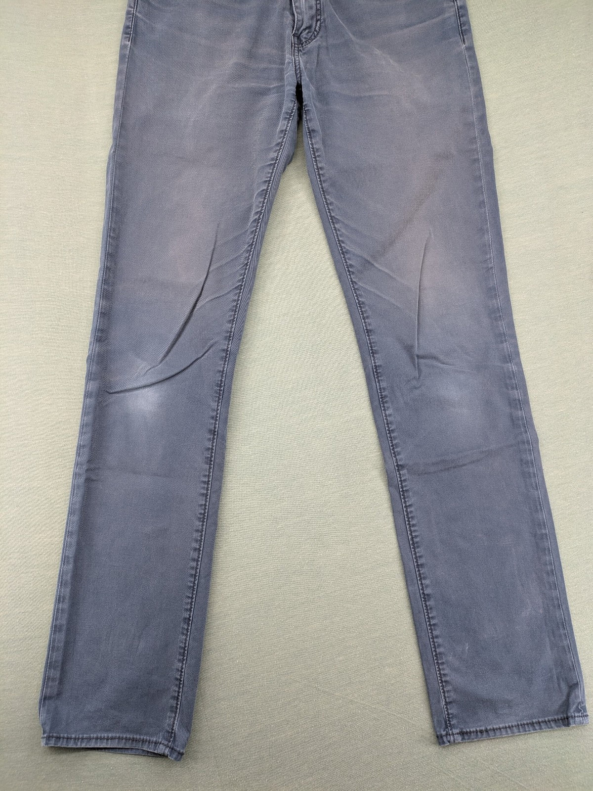 Levi's blue slim fit jeans with faded wash and classic 5-pocket design.
