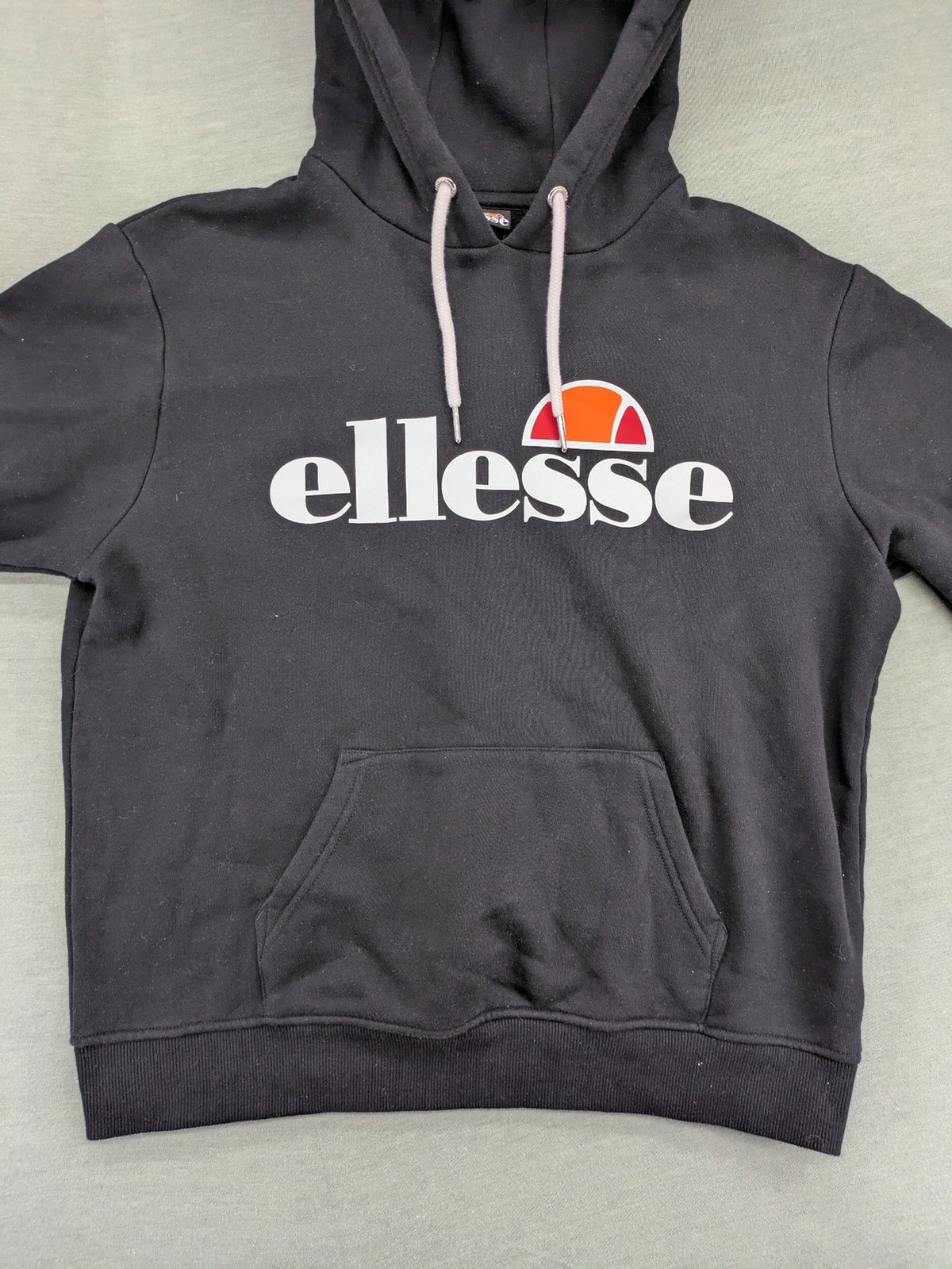 Ellesse grey hoodie with large logo, kangaroo pocket, and drawstring hood.