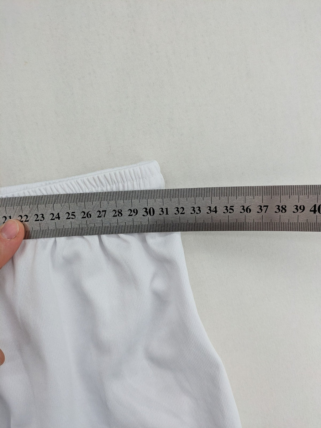 UEFA EURO 2024 white shorts with Germany crest and logo, elastic waistband, breathable material.