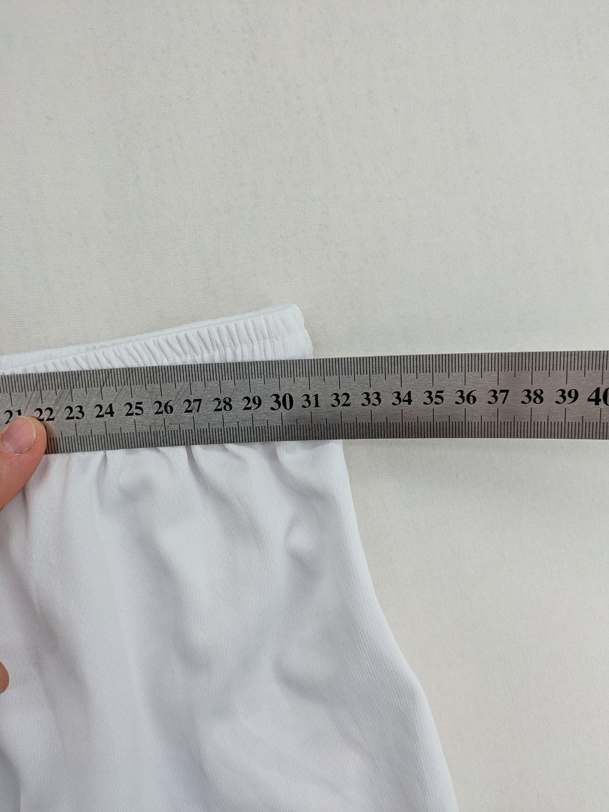 UEFA EURO 2024 white shorts with Germany crest and logo, elastic waistband, breathable material.