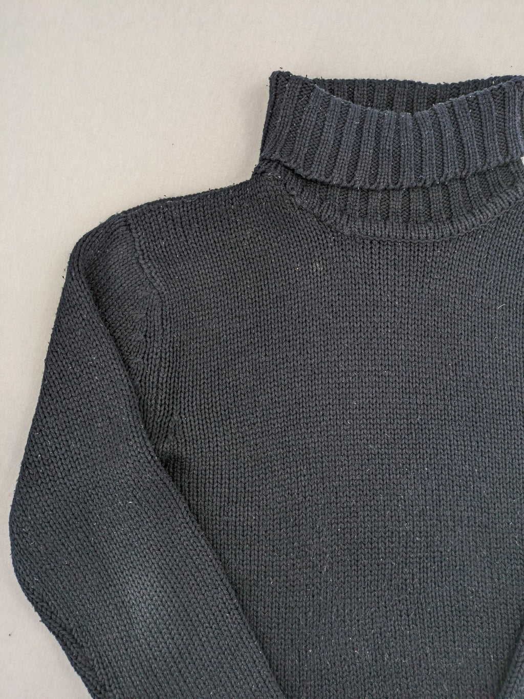 Fishbone grey turtle neck jumper with ribbed cuffs and soft acrylic knit material.