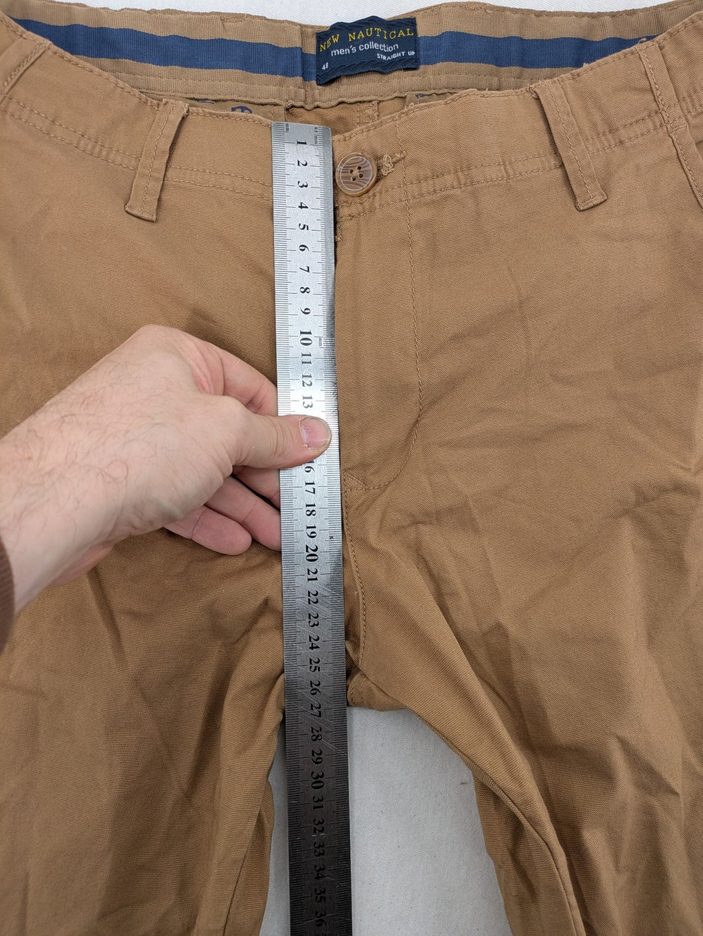 Nautical tan chino pants straight fit cotton blend with subtle anchor print lining.
