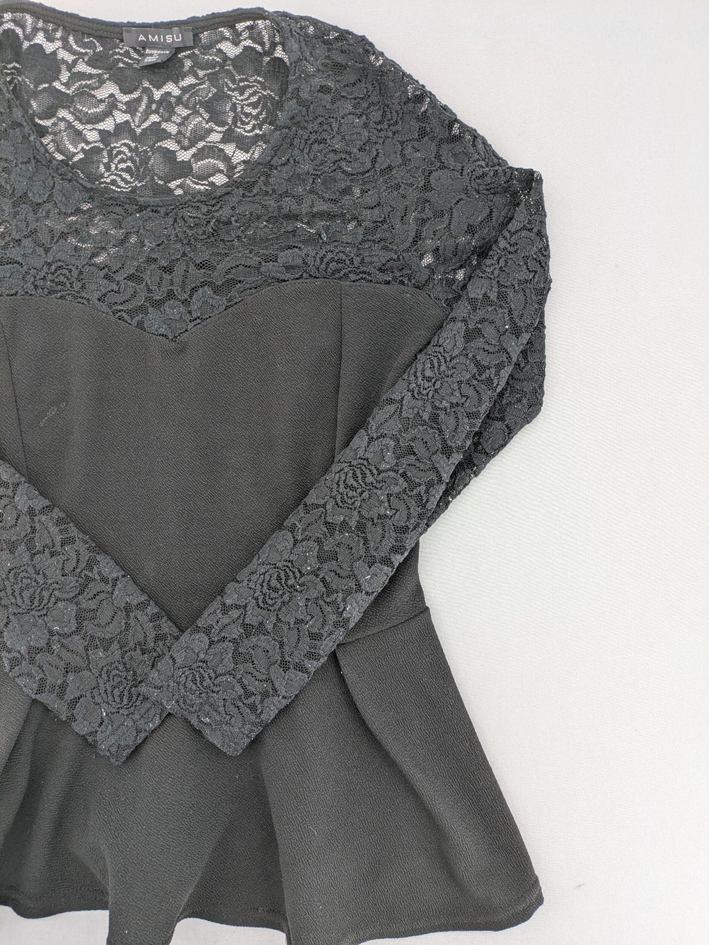 Amisu black peplum top with floral lace sleeves and delicate lace trim.