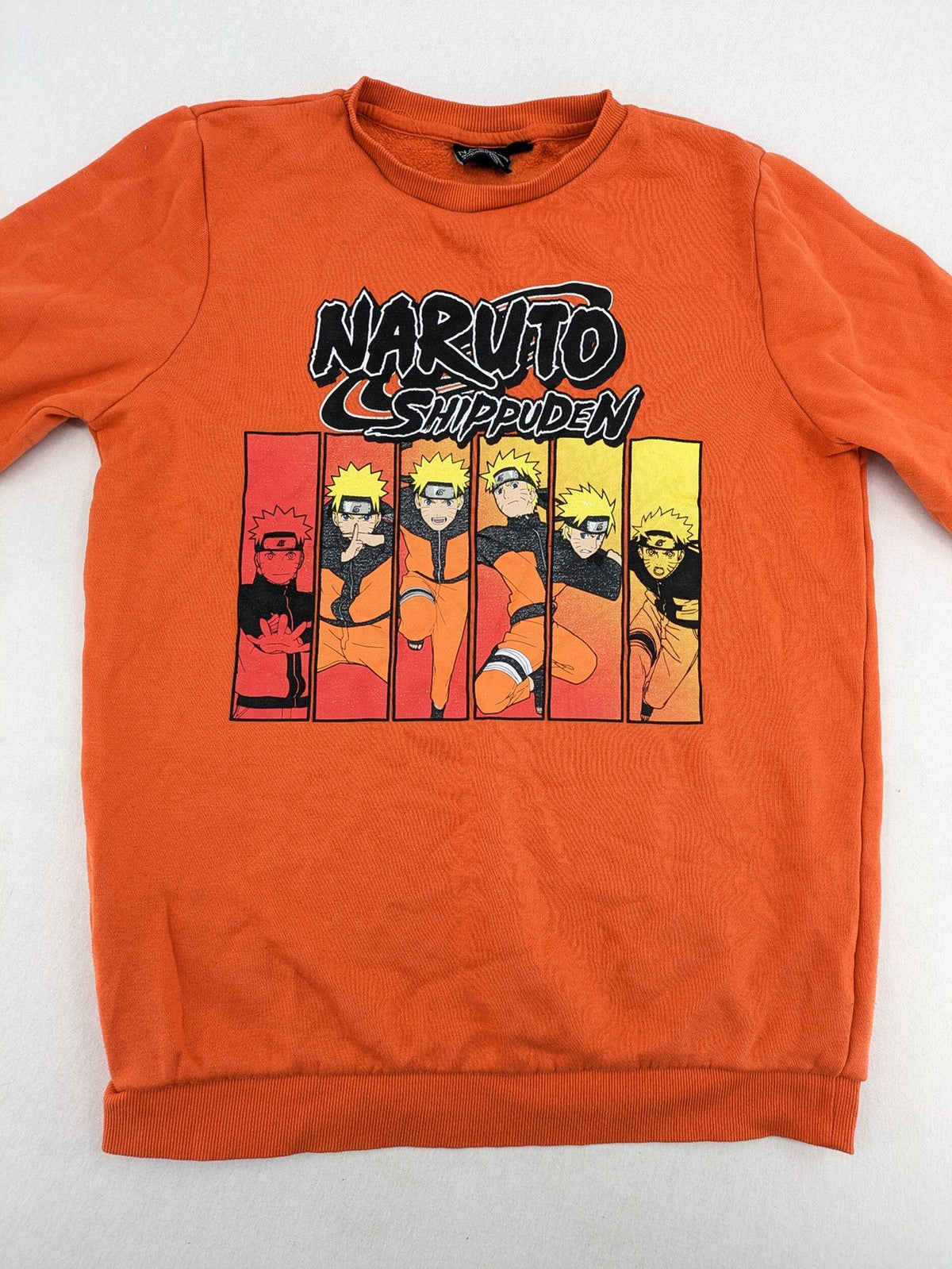 Naruto Shippuden orange sweatshirt featuring vibrant Naruto Uzumaki graphic print, classic crew neck.