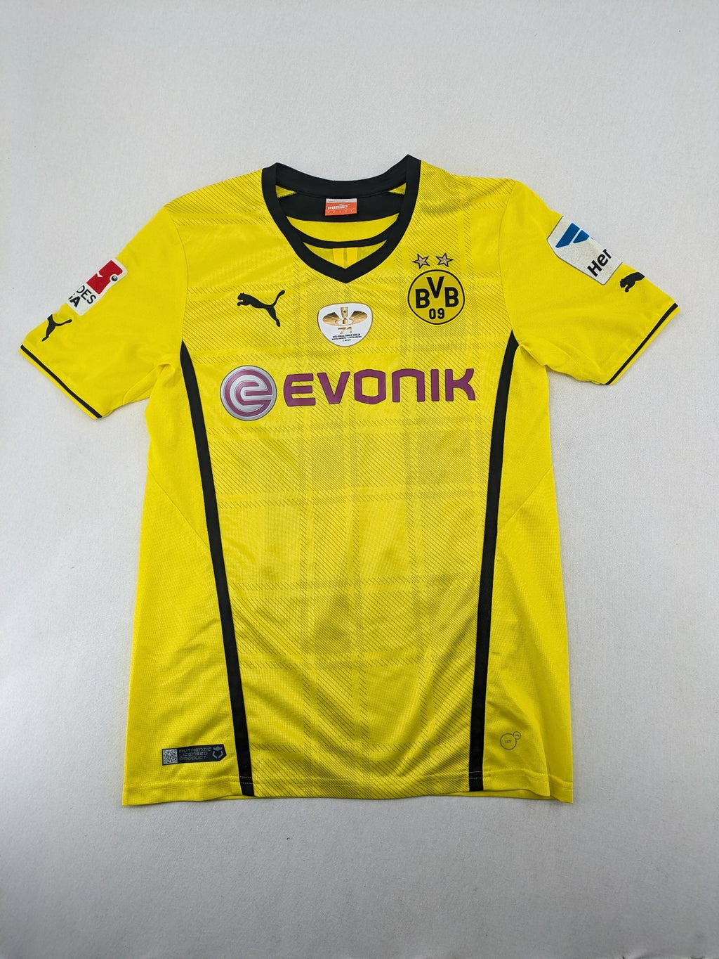 Borussia Dortmund black and yellow soccer uniform with DFB Pokal 2014 patch and Puma logo.