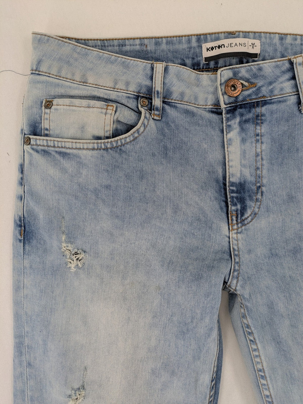 Koton Jeans blue straight jeans with distressed details and classic 5-pocket style.