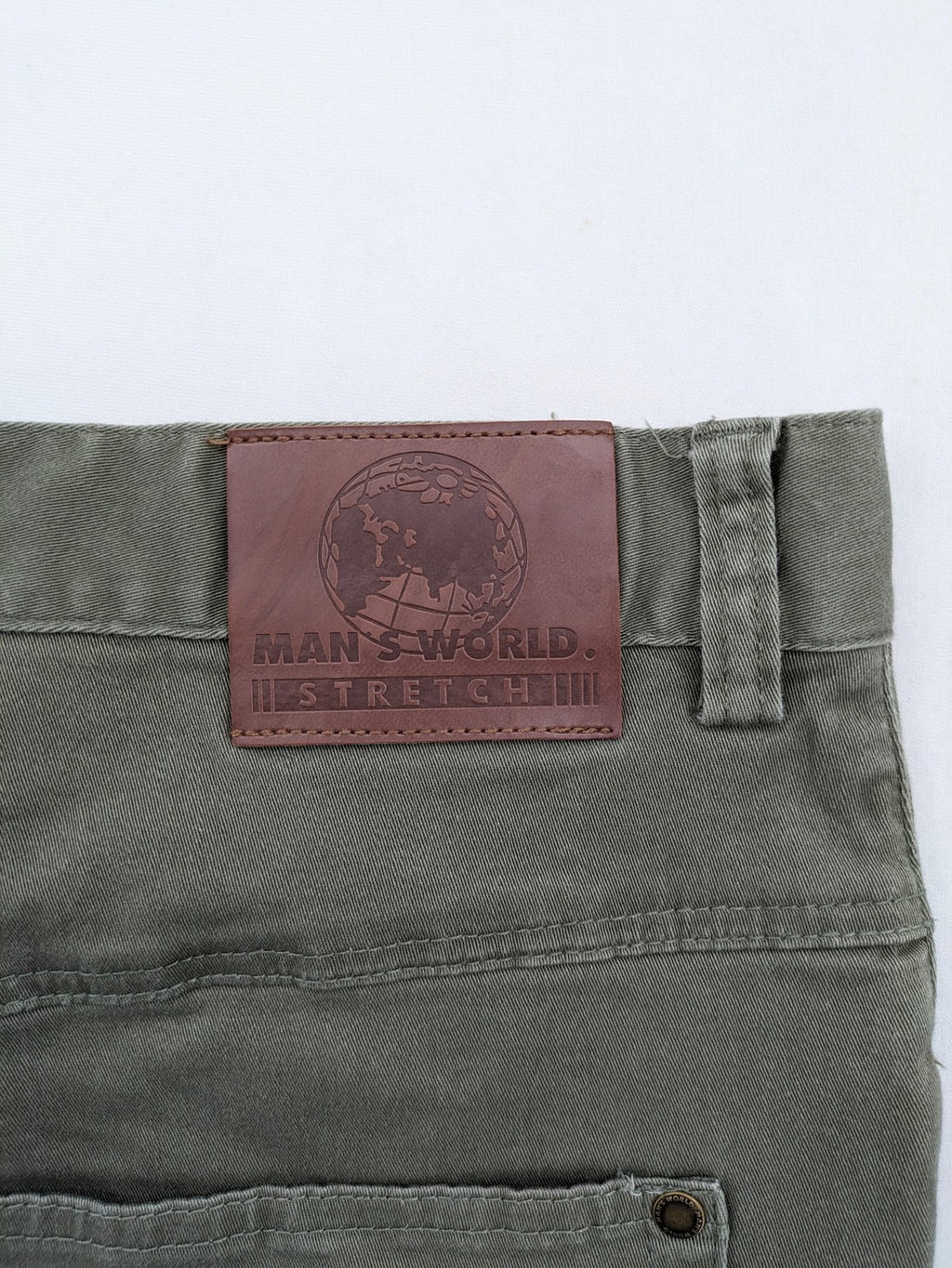 Man's World khaki chino pants with button and zipper closure, made from cotton-elastane blend.