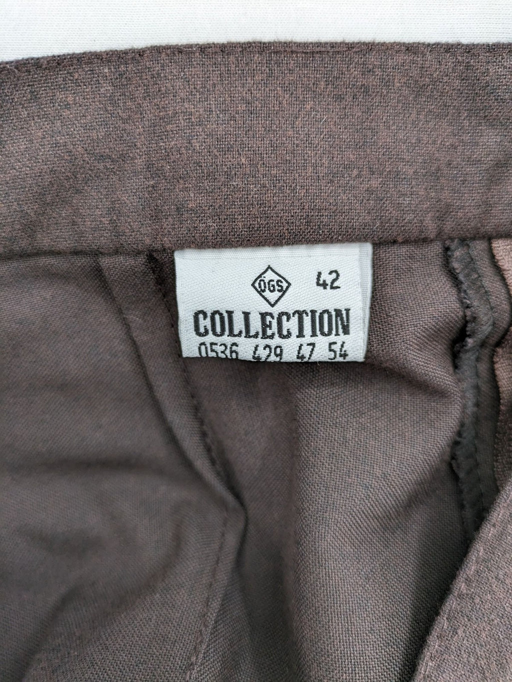 öGS Collection pink high waist pants with front pleats and structured fit.