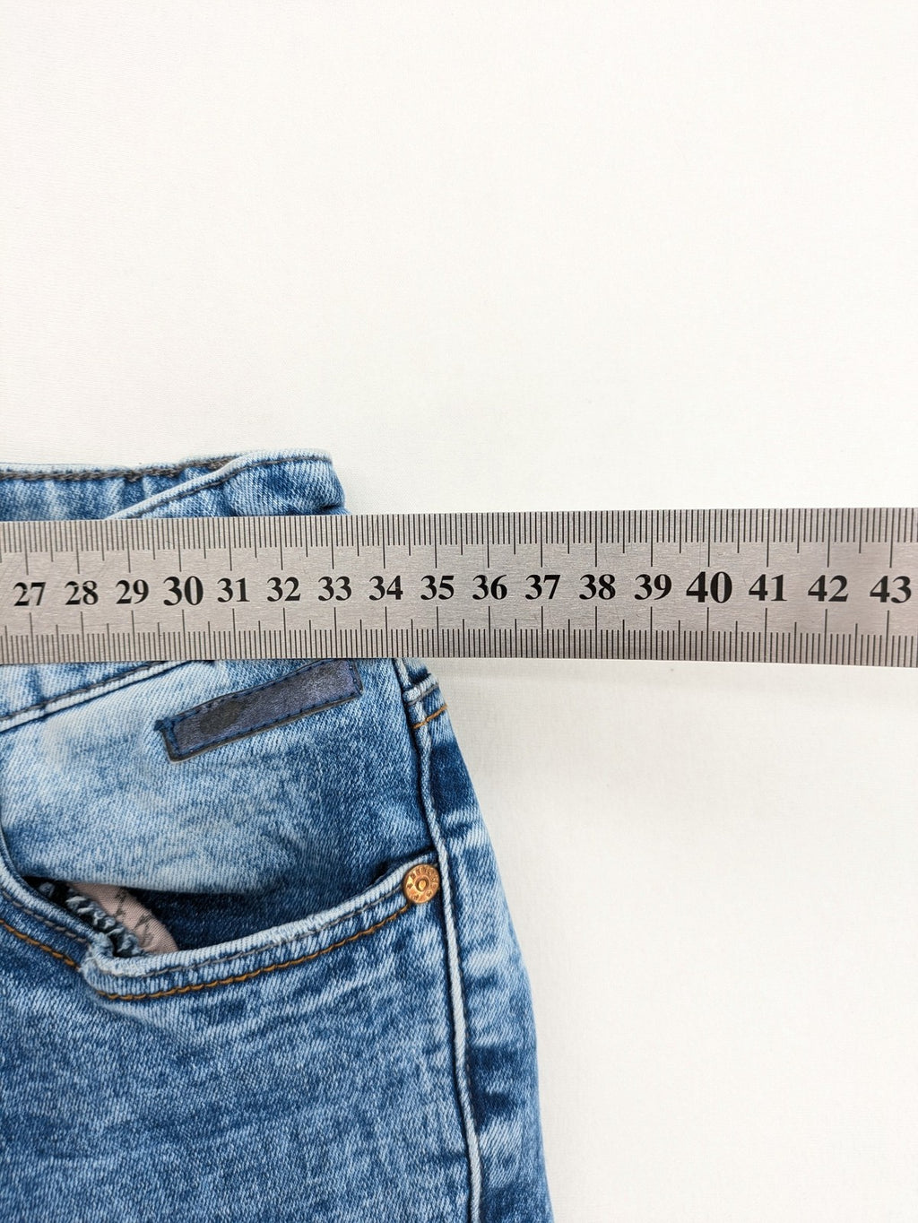 Retour blue slim fit jeans with classic 5-pocket style and adjustable waistband.