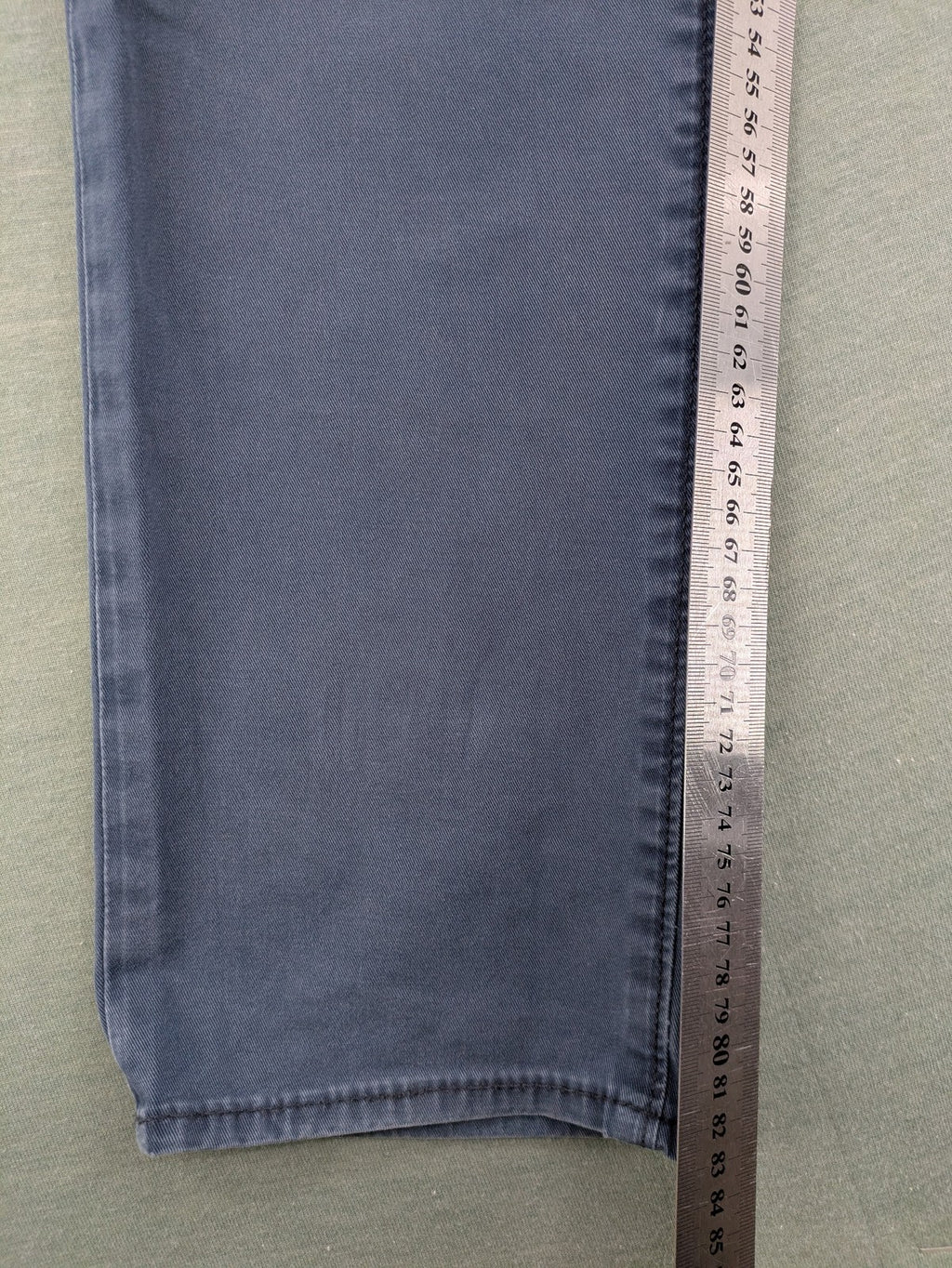 Levi's blue slim fit jeans with faded wash and classic 5-pocket design.