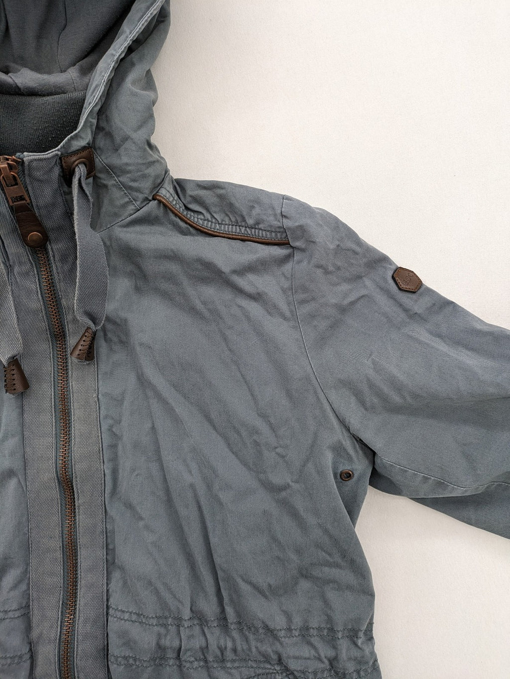 edc grey parka jacket with hood, adjustable drawstrings, and striped lining