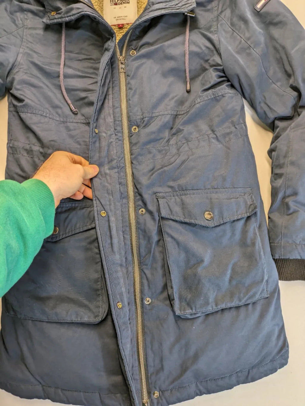 Tommy Hilfiger Denim blue parka coat with faux fur hood and Sherpa lining.