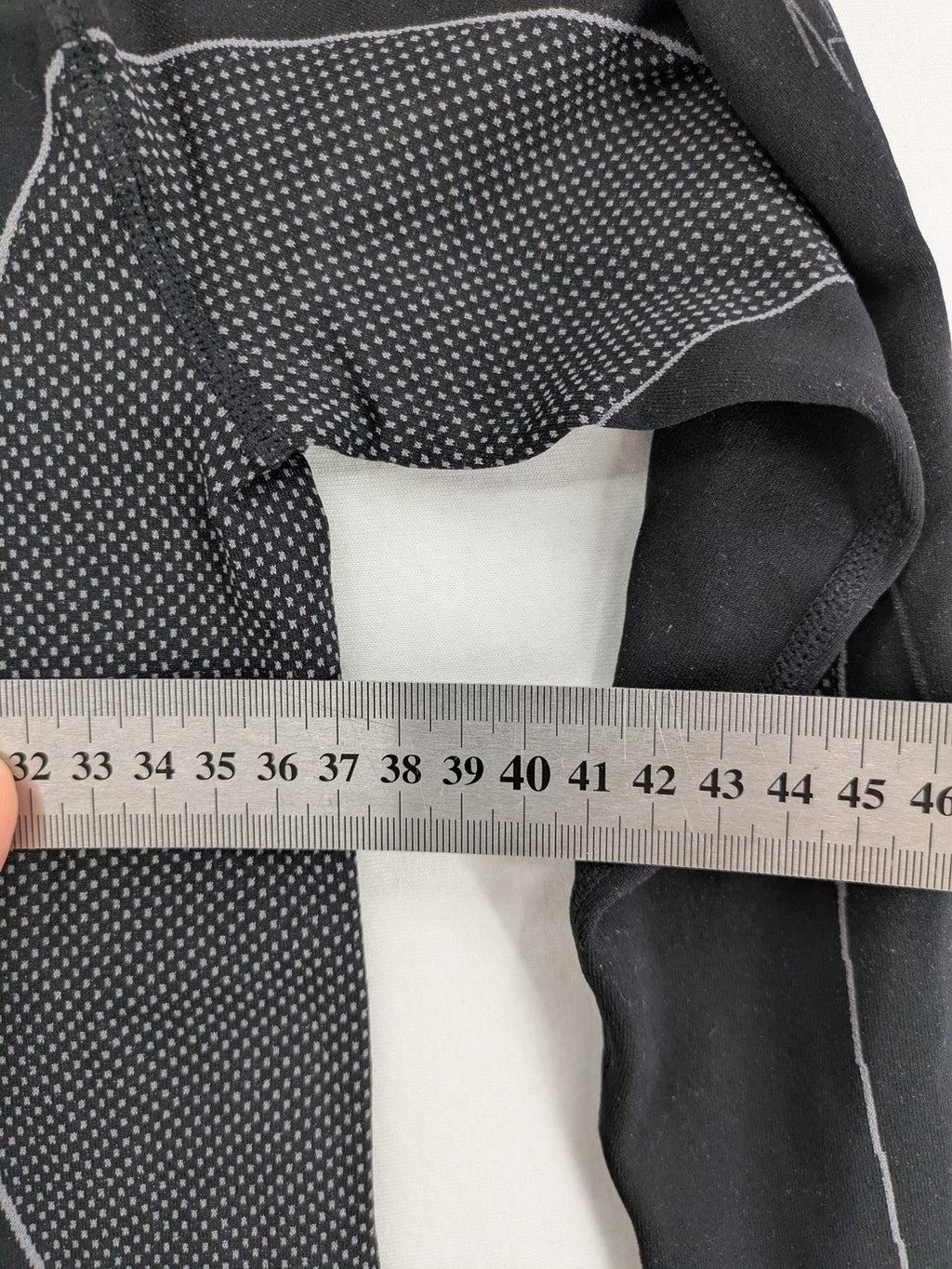 Iron-ic black long sleeve baselayer top with standing collar and thumbholes.